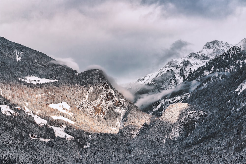 landscape photography of mountain with clouds above