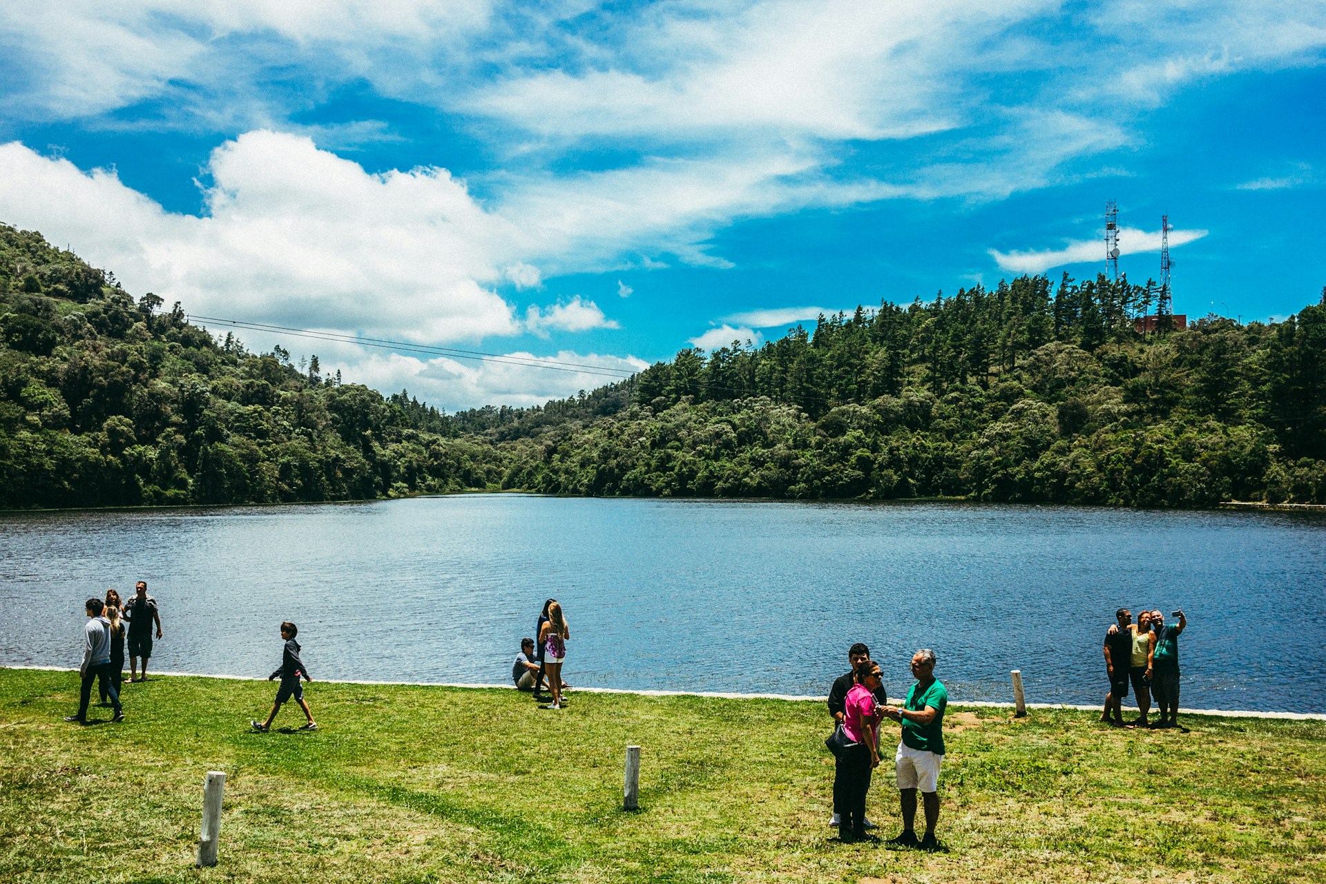 woman wearing yellow long-sleeved dress under white clouds and blue sky during daytime