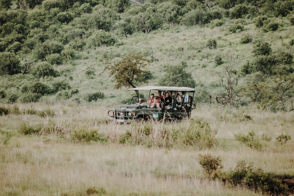 person riding in green UTV