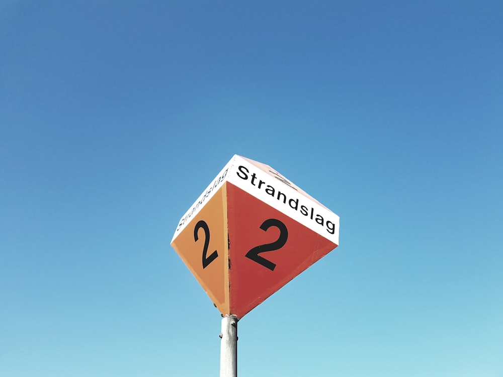worm's eye view of Strandslag 2 signage
