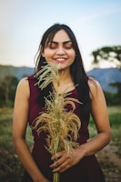 woman standing while holding plant