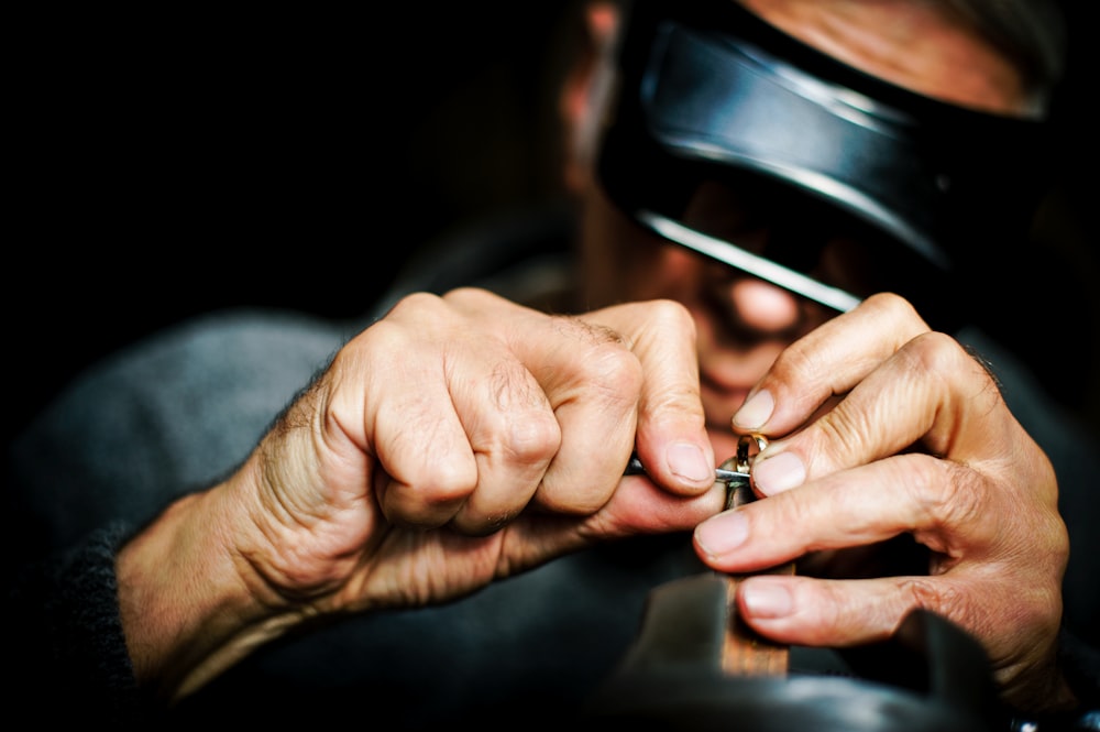 person holding metal tool