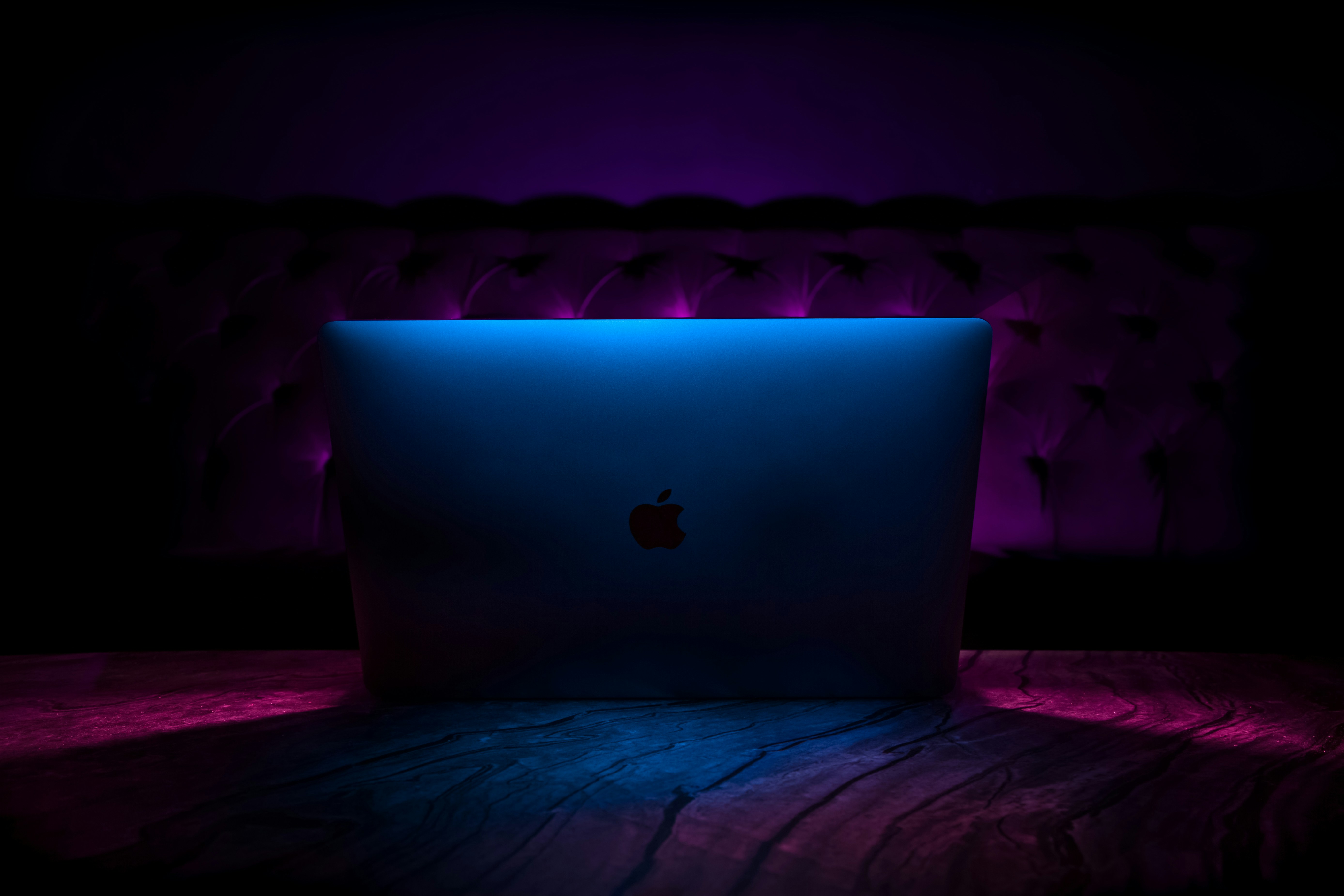 My MacBook Pro is being light painted by an RGB smartphone app for 8 seconds.