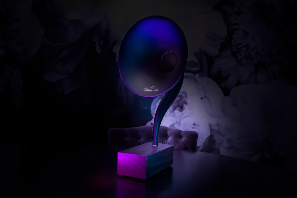 purple table lamp on table