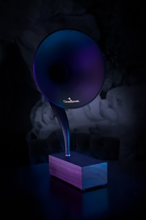 A sleek modern music box with a minimalist design and soft glowing lights