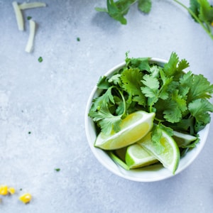 sliced lime in white ceramic bowl