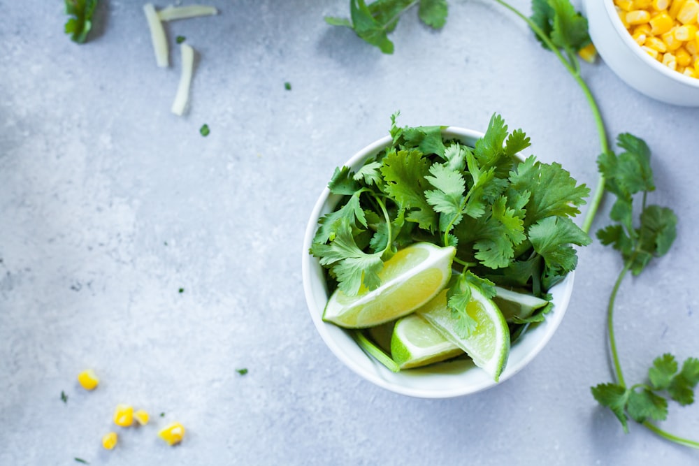 sliced lime in white ceramic bowl