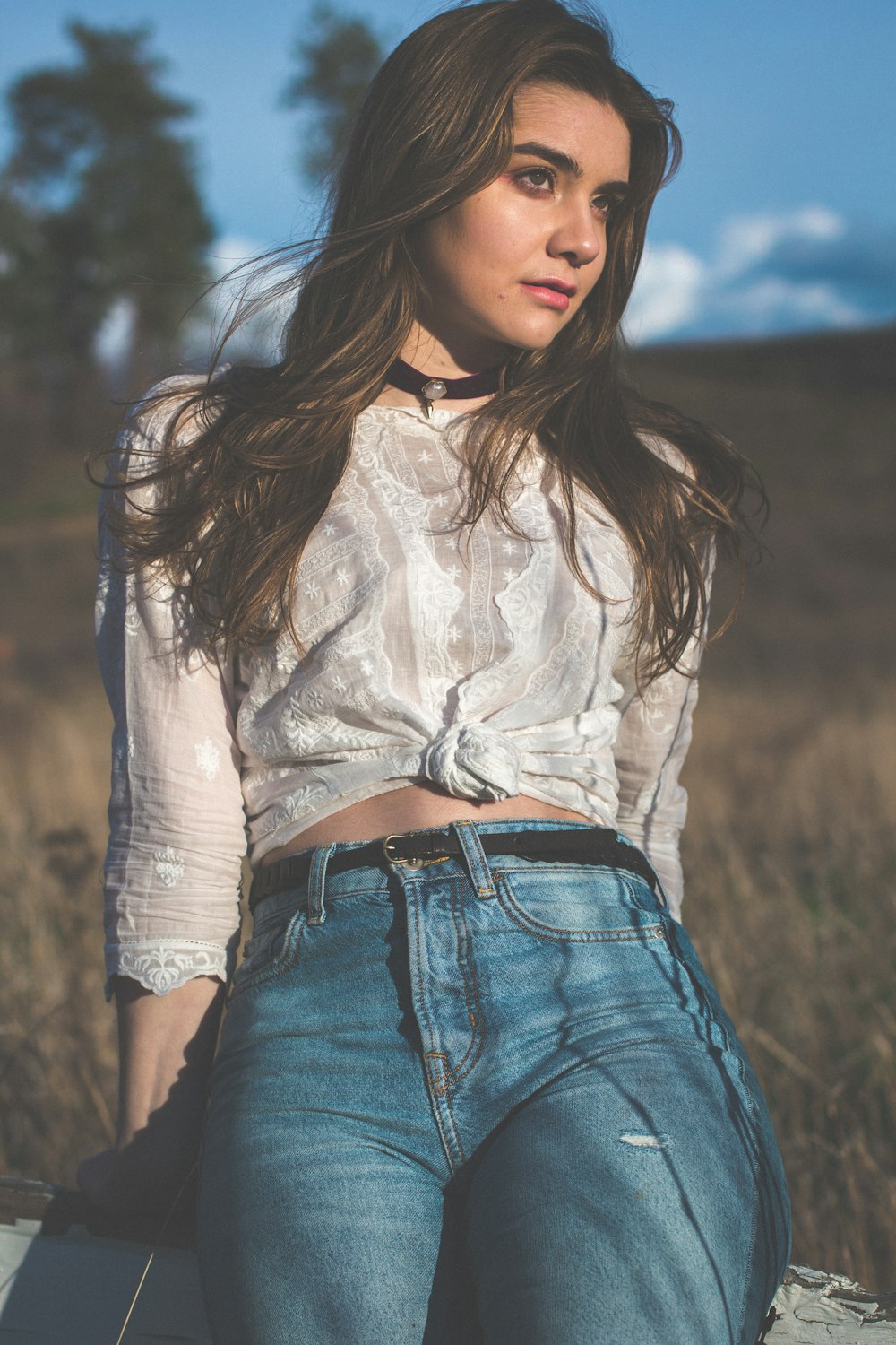 woman sitting on grass field