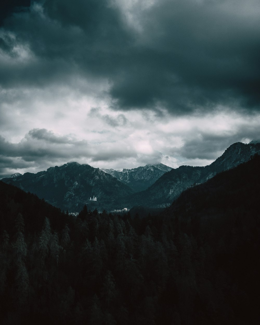 mountains under cumulus clouds