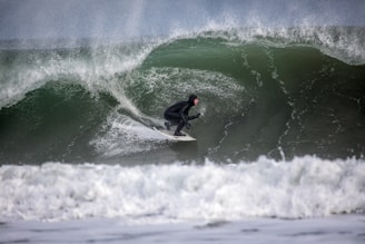 person surfing using white surfboard