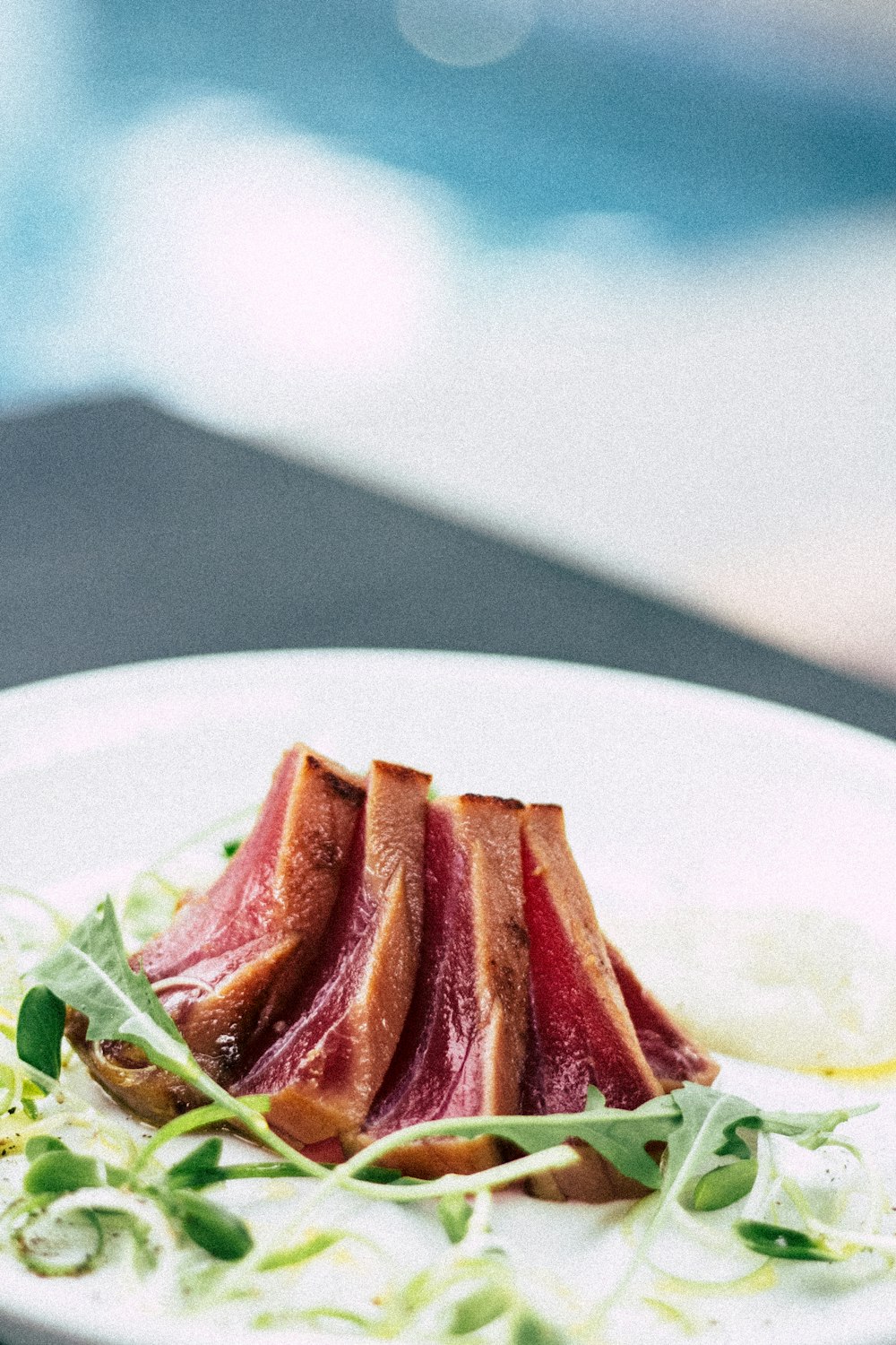 roasted meat served on ceramic plate