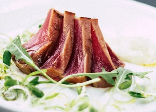 roasted meat served on ceramic plate