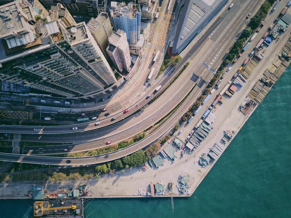 aerial view of road beside body of water