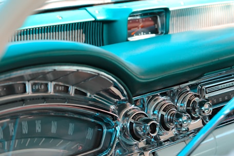 A close-up of a classic car's dashboard, highlighting its intricate details and craftsmanship.