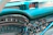 Close-up of a vintage car dashboard with custom gauges and leather details.