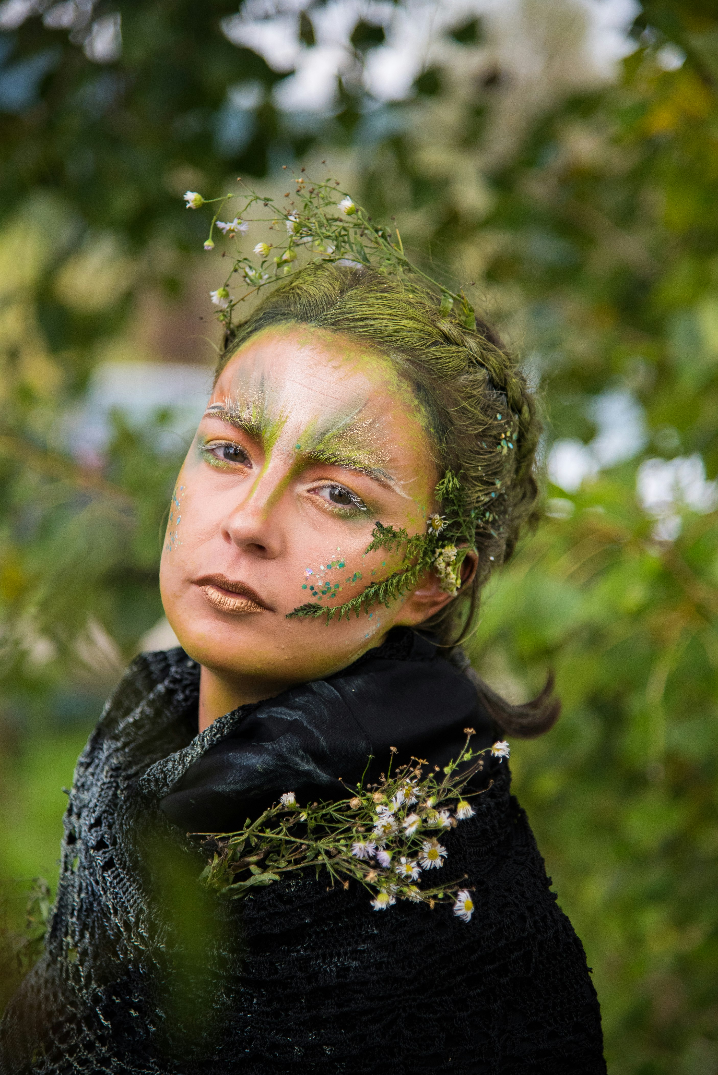 selective focus photo of woman with nature-themed makeup