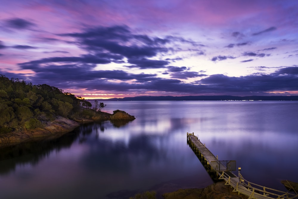 landscape photography of mountains and body of water