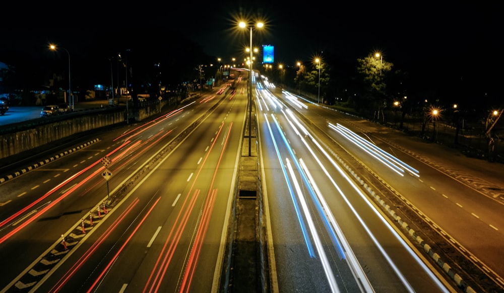 time lapse photo of cars on road