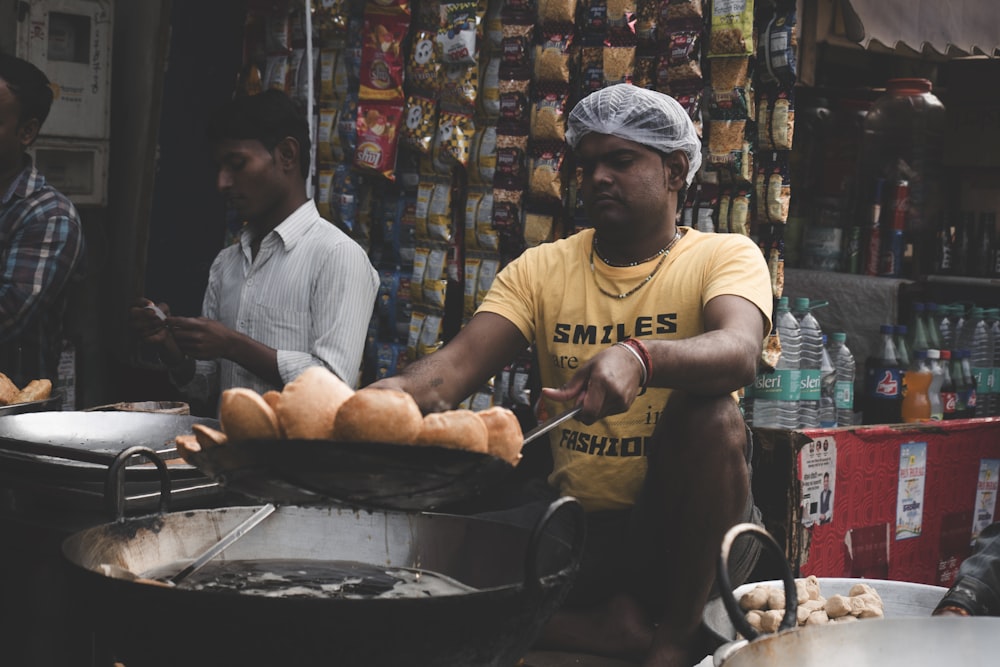 man holding cooking pat