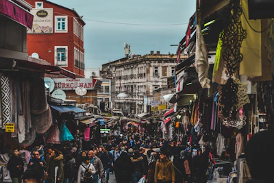Field researchers conducting interviews in a vibrant Latin American street market.