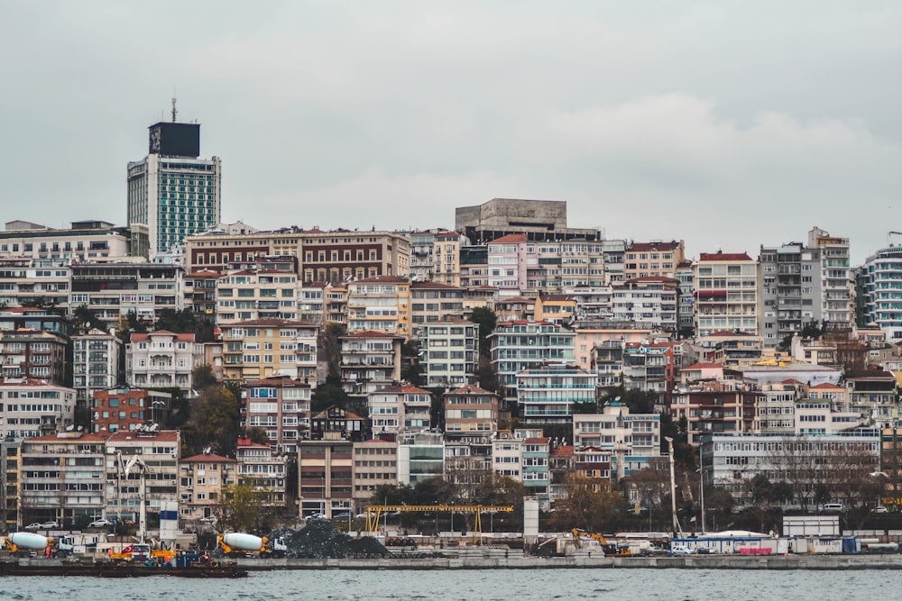 assorted-color buildings near body of water