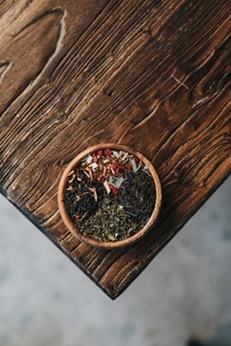 herbs filled brown bowl