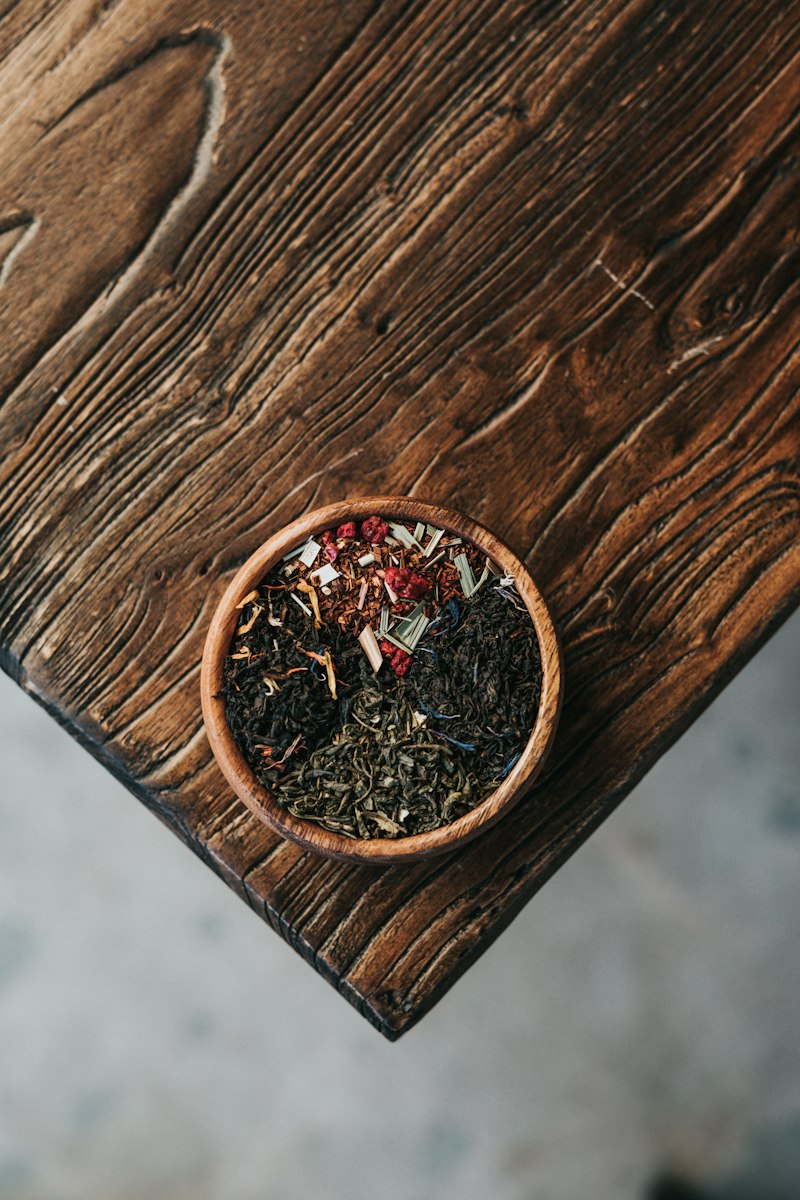 Powdered herbal blend in a small bowl — a personalized formula.