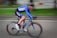 timelapse photography of man riding bicycle