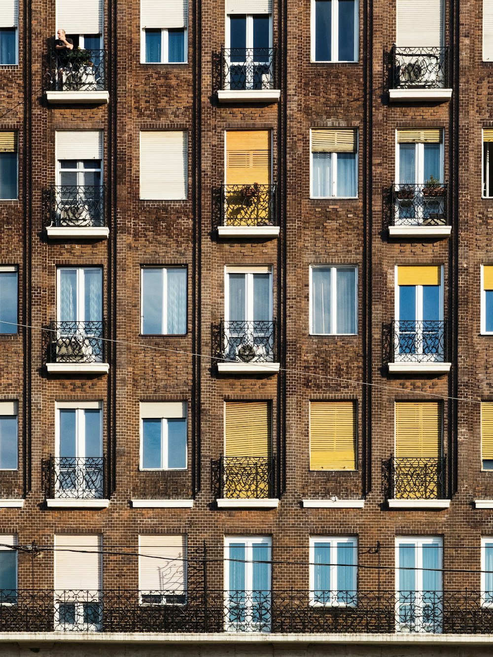 brown concrete apartment during daytime