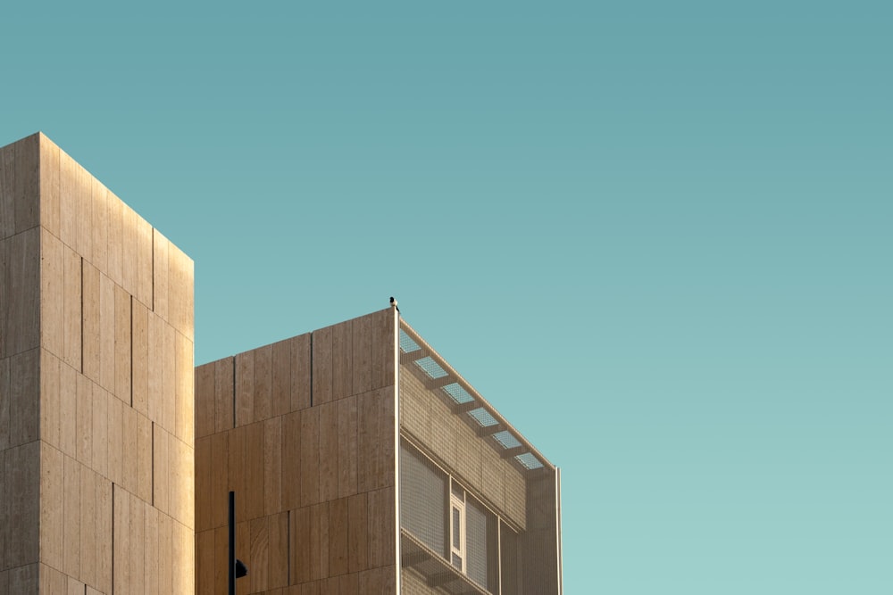 brown high-rise building under clear sky during daytime