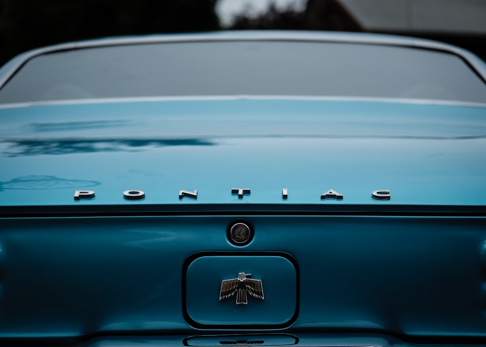 teal Pontiac car