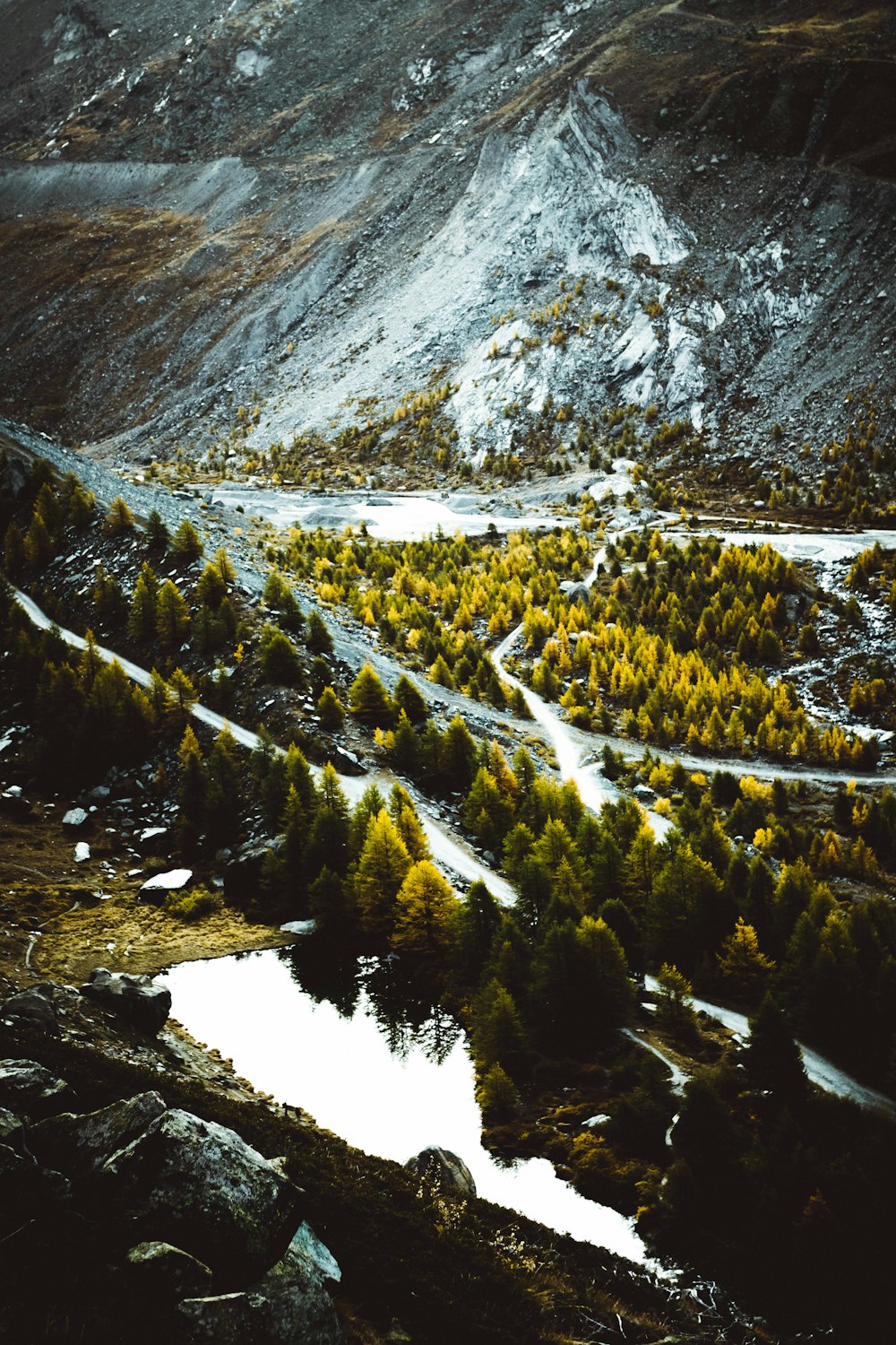 aerial photography of mountain and body of water