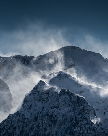 snow covered mountains under clear blue sky