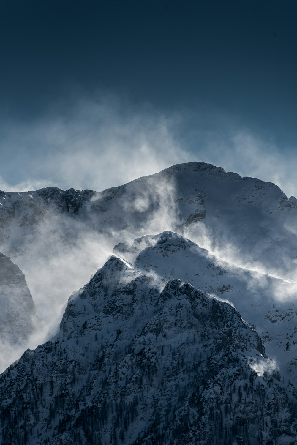 snow covered mountains under clear blue sky