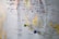 A close-up of a map featuring South East Asia, with colorful pins marking various locations such as Malaysia, Singapore, and Indonesia. The focus is on the area around the South China Sea and Indian Ocean, with cities like Kuala Lumpur and Jakarta visible.