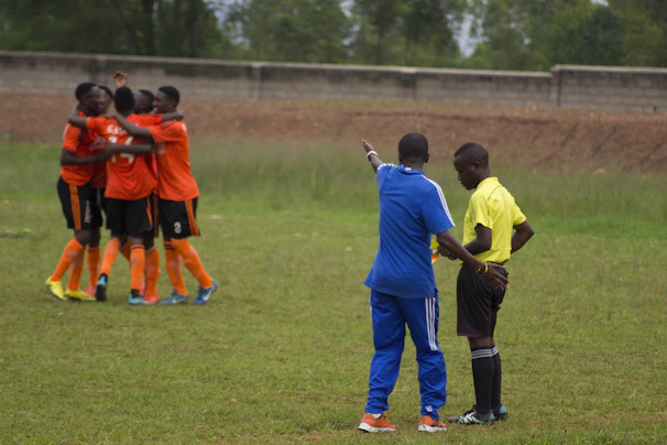A group photo of the school soccer team celebrating after a match.
