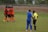 A group of boys celebrating after a football match.
