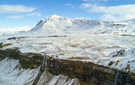 aerial view of snowy mountain in Skógafoss Iceland