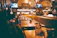 Cozy dining area at nasib restaurant with warm lighting and happy guests enjoying meals.
