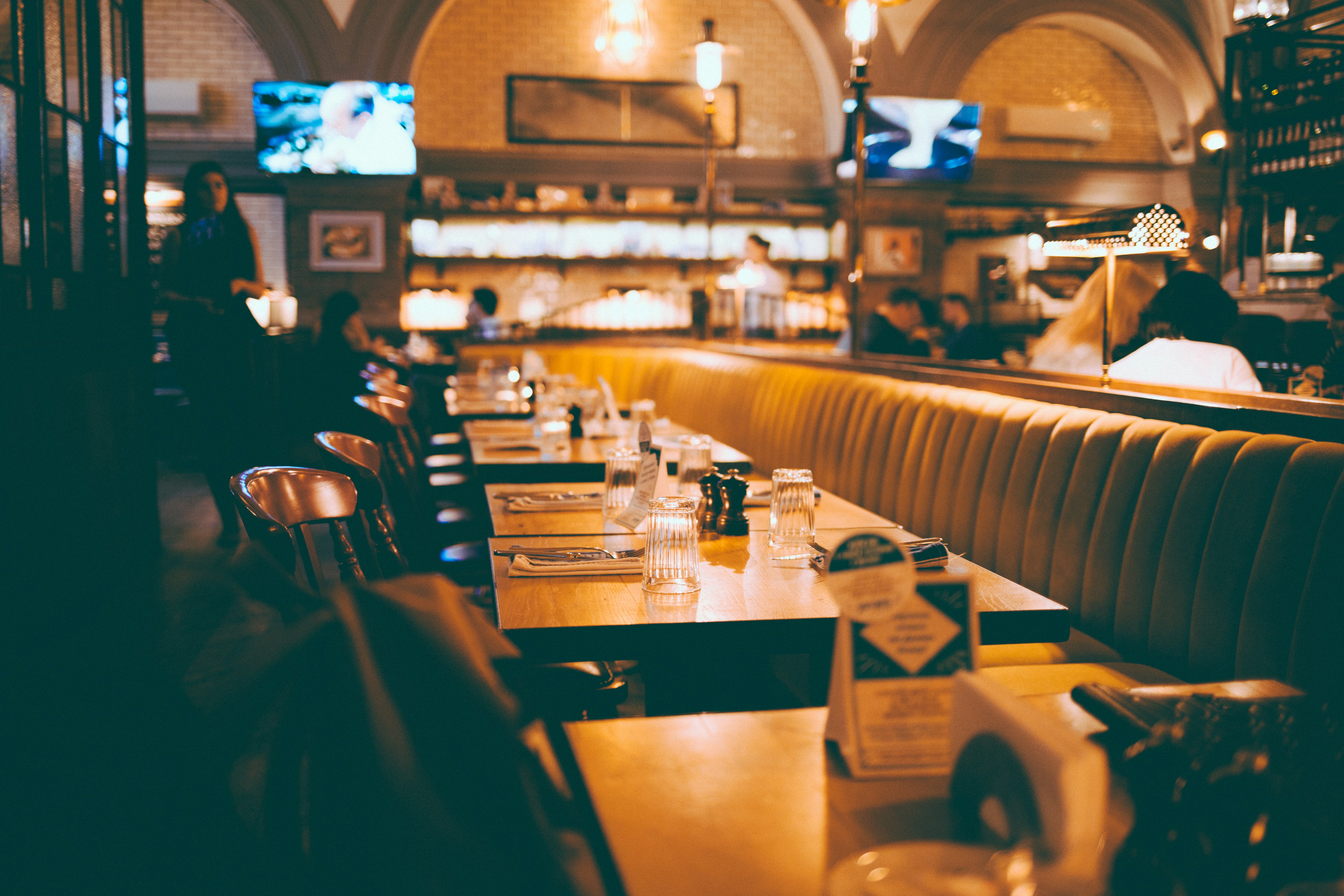 depth photography of empty table inside restaurant