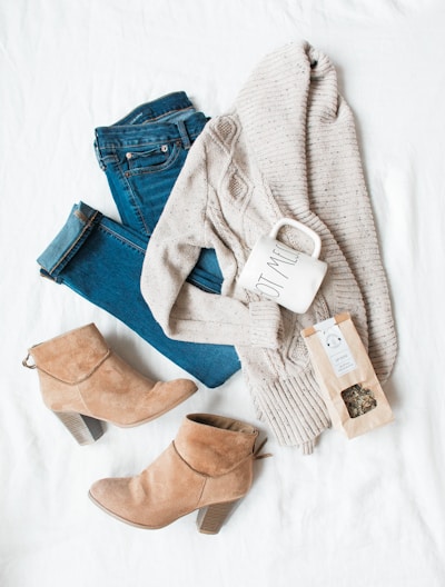 gray cardigan, blue jeans, and pair of brown chunky heeled shoes