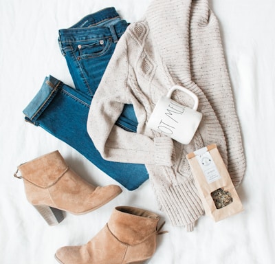 gray cardigan, blue jeans, and pair of brown chunky heeled shoes