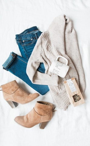 gray cardigan, blue jeans, and pair of brown chunky heeled shoes