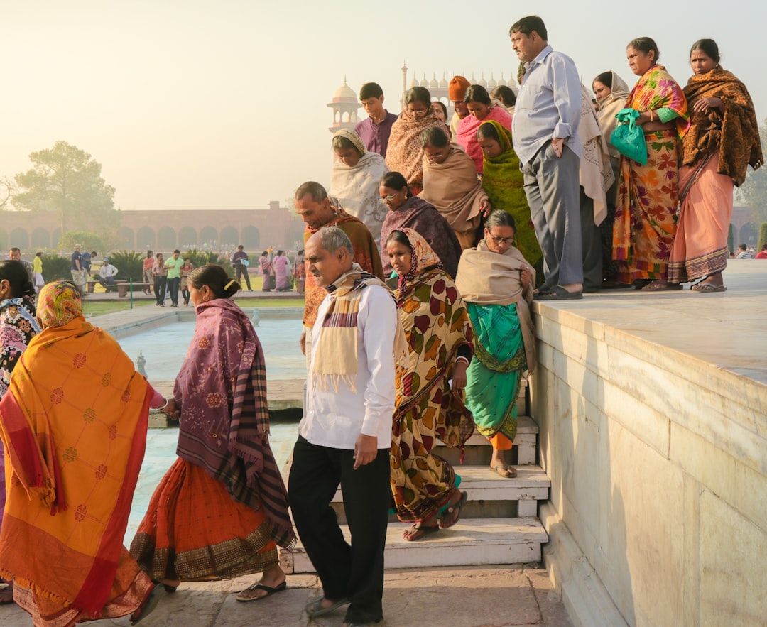 people standing near swimming pool, Early Morning at the Taj Mahal