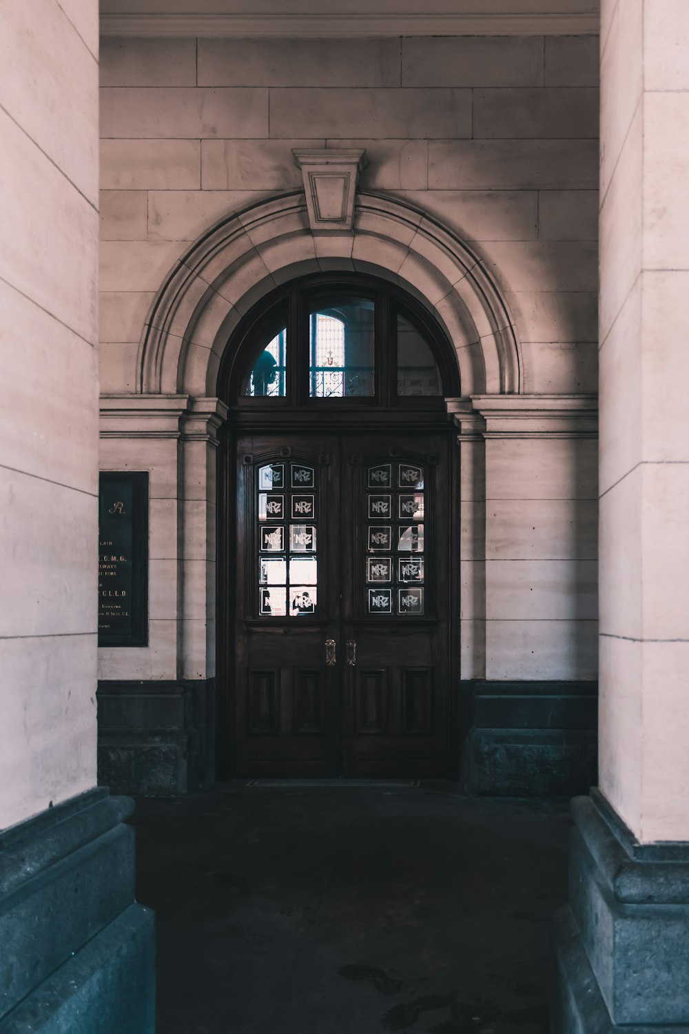 brown wooden door of the building