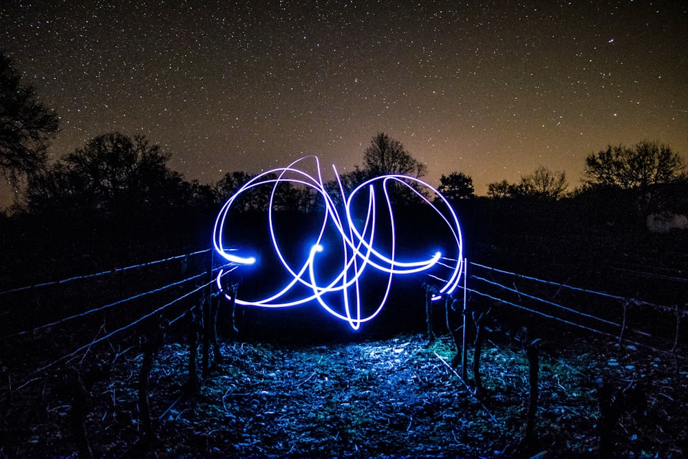 long exposure photo of purple LED light