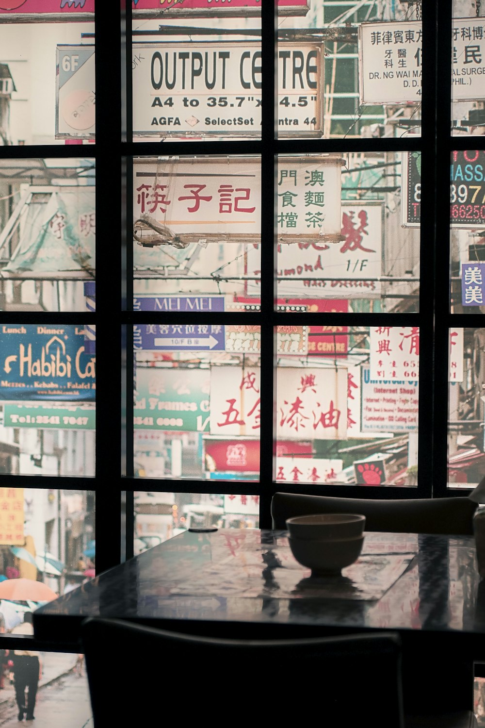 view of assorted signages through window