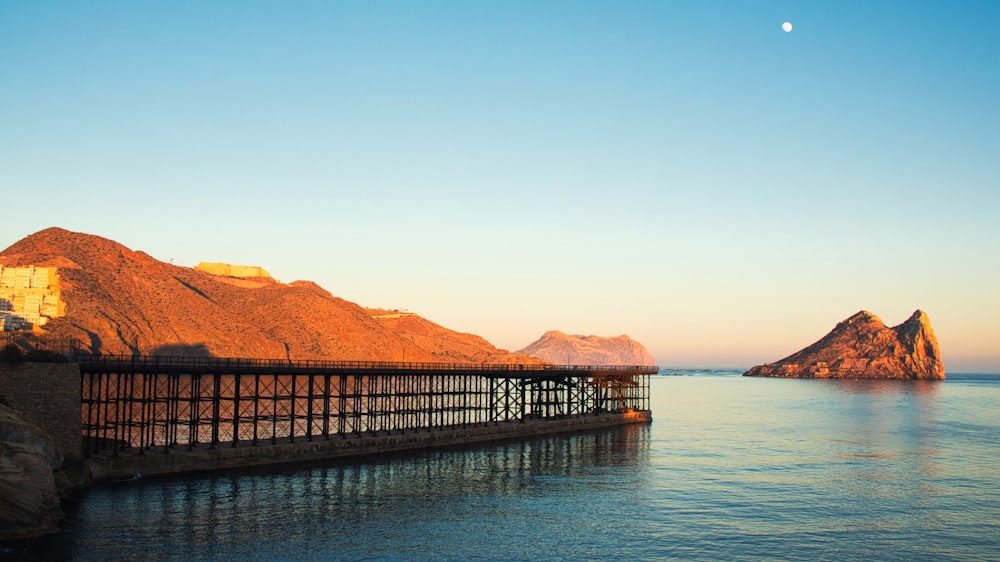 photo of brown dock near mountain