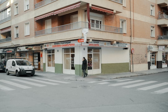 orange and white concrete building in Granada Spain