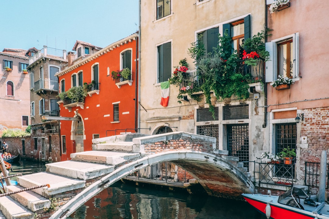 concrete bridge beside white building